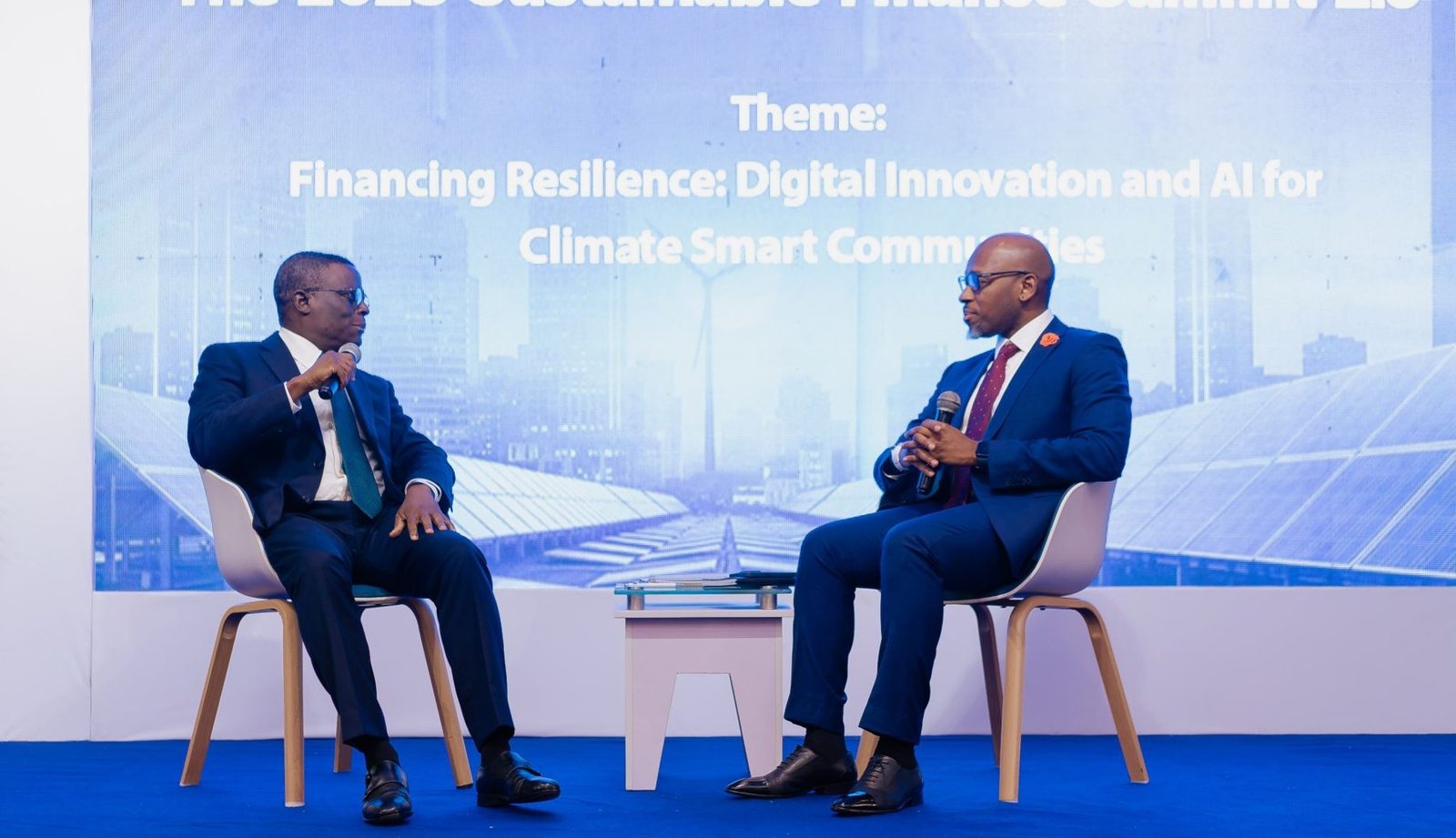 Olu Akanmu moderating a fireside chat on AI and sustainable finance